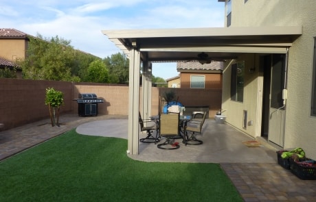 covered patio pavers turf and stone bench