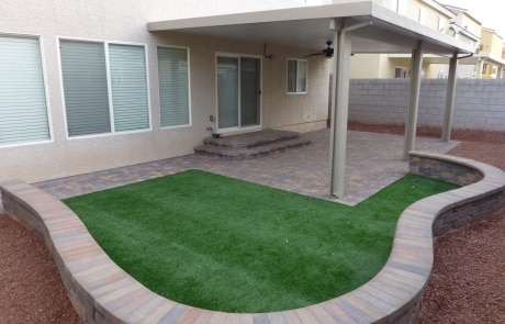 turf grass stone paver covered patio