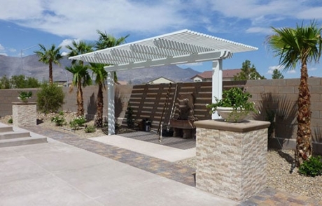 backyard featuring desert landscaping, stone pavers, plants