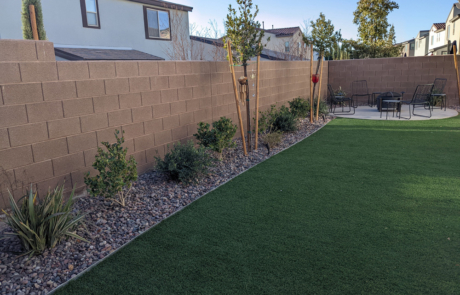 landscaping for cooler weather, foliage lined the wall of a beautifully landscaped yard.